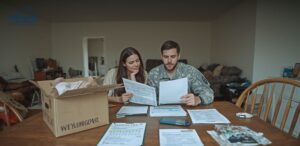 Military family reviewing a PCS home selling timeline with PCS orders, report-date calendar, agent notes, moving boxes, and home preparation checklist.